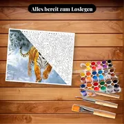 Malen nach Zahlen Tiger rennt durch den Schnee – Set bereit zum Loslegen auf dem Tisch