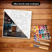 Malen nach Zahlen Australian Shepherd vor einem Glas Bier – Set bereit zum Loslegen auf dem Tisch